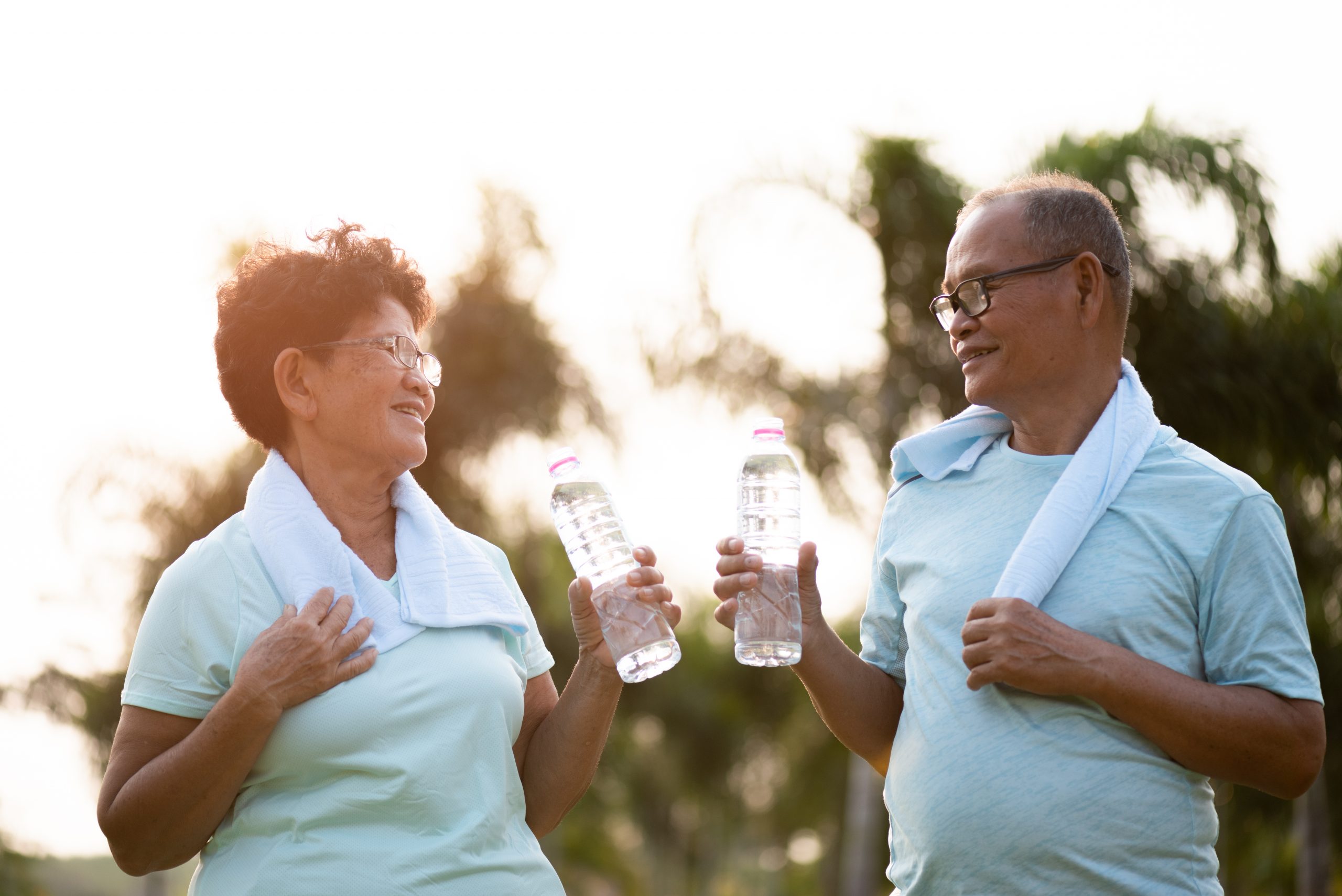 A couple of asian old man and woman doing physical exercise outd
