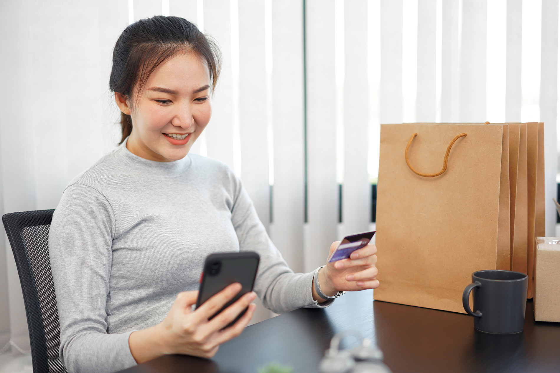 Shopping online concept a female shopper enjoys picking and purc